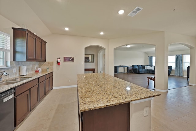 127 Pasture Ln, Decatur, TX 76234 - kitchen featuring dishwasher, light tile patterned floors, a center island, plenty of natural light, and recessed lighting