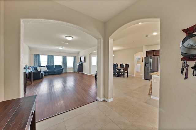 127 Pasture Ln, Decatur, TX 76234 - foyer featuring arched walkways and light tile patterned flooring