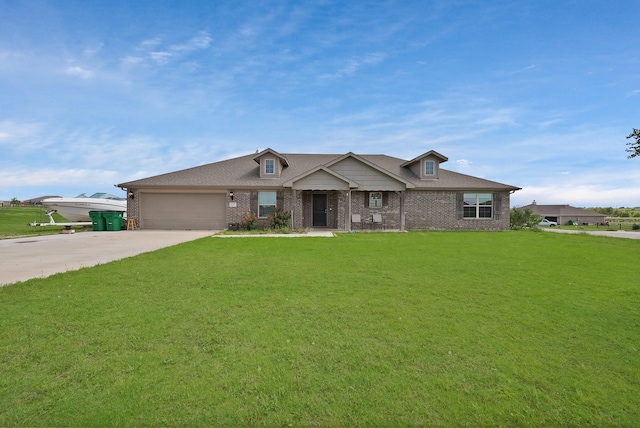 127 Pasture Ln, Decatur, TX 76234 - view of front of property with brick siding, a front yard, a garage, and concrete driveway