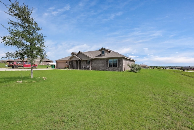 127 Pasture Ln, Decatur, TX 76234 - view of front facade with a front lawn, brick siding, and driveway