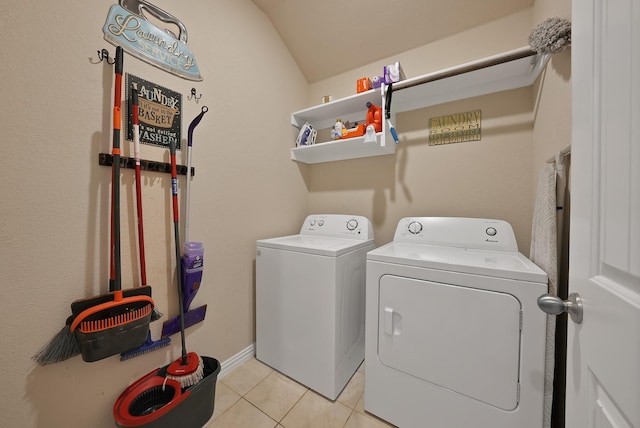 127 Pasture Ln, Decatur, TX 76234 - washroom with washer and dryer and light tile patterned flooring