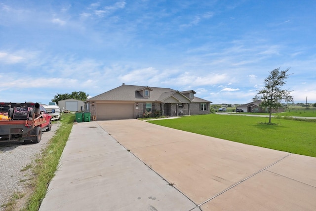 127 Pasture Ln, Decatur, TX 76234 - traditional home featuring brick siding, a front lawn, driveway, and an attached garage
