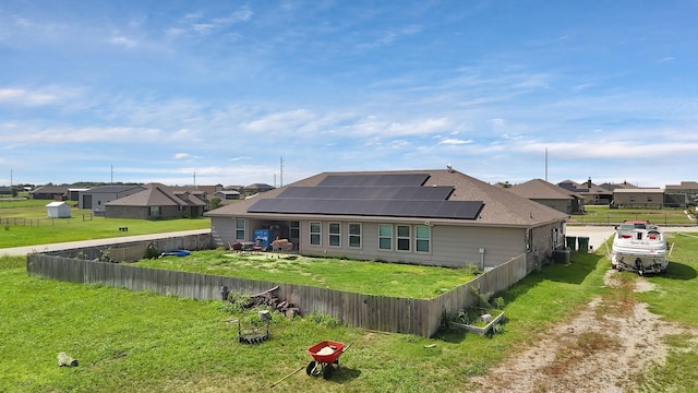 127 Pasture Ln, Decatur, TX 76234 - rear view of property featuring solar panels, a residential view, and a fenced backyard