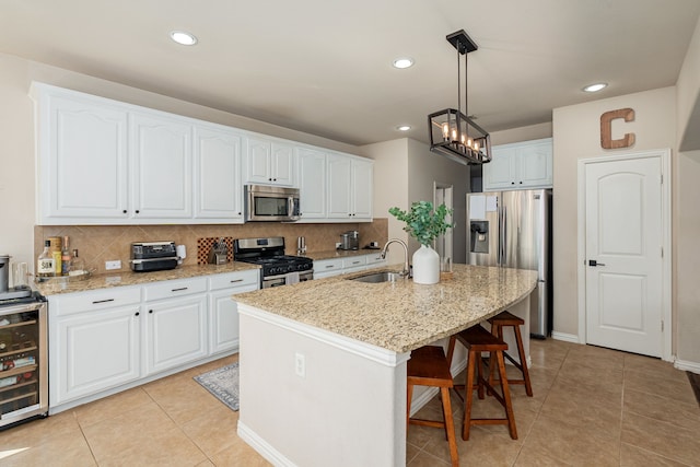 2209 Willard Dr, Mckinney, TX 75072 - kitchen featuring stainless steel appliances, beverage cooler, backsplash, light tile patterned flooring, and recessed lighting