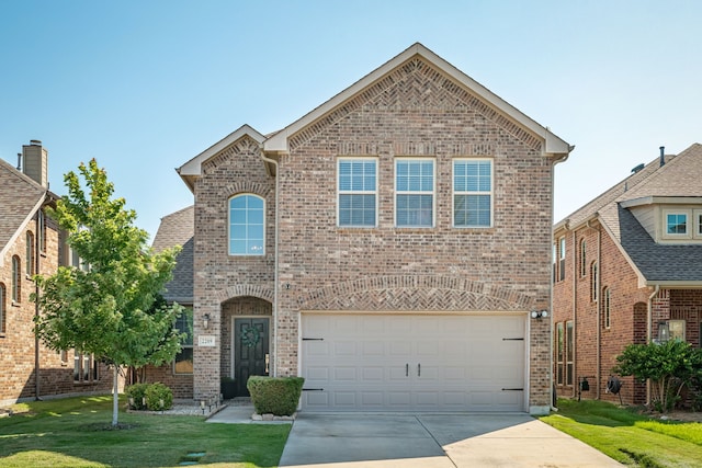 2209 Willard Dr, Mckinney, TX 75072 - view of front of property featuring brick siding, concrete driveway, a front yard, and a garage