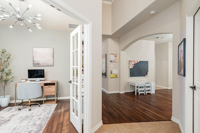 2209 Willard Dr, Mckinney, TX 75072 - office featuring arched walkways, a chandelier, wood finished floors, and french doors