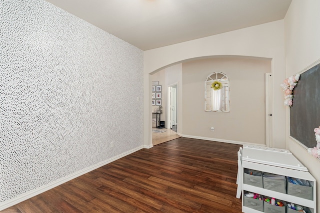 2209 Willard Dr, Mckinney, TX 75072 - unfurnished room with arched walkways and wood finished floors