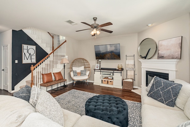2209 Willard Dr, Mckinney, TX 75072 - living area with ceiling fan, wood finished floors, stairs, and a fireplace