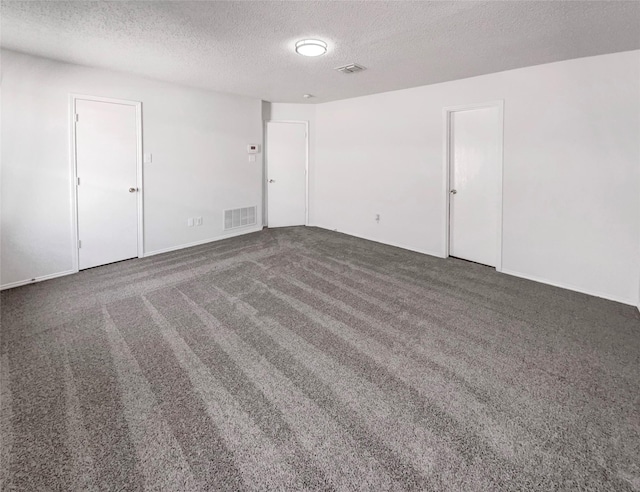 2428 Marimont Ln, Lancaster, TX 75134 - spare room with a textured ceiling and carpet floors