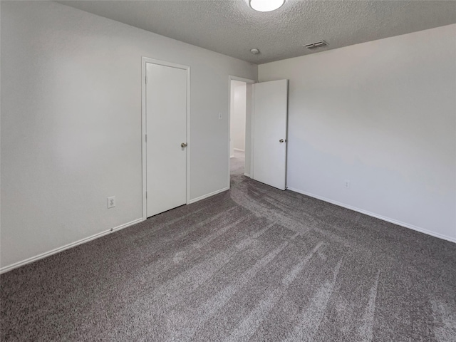 2428 Marimont Ln, Lancaster, TX 75134 - spare room featuring a textured ceiling and carpet floors