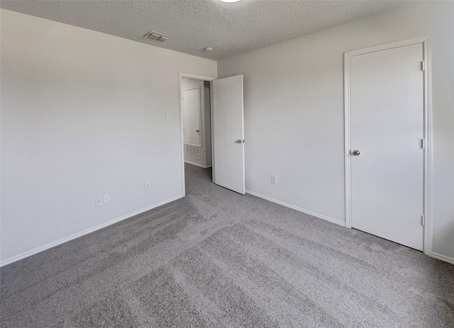 2428 Marimont Ln, Lancaster, TX 75134 - unfurnished bedroom with carpet and a textured ceiling