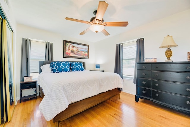 2315 Cardinal Ln, Garland, TX 75042 - bedroom featuring light wood finished floors, a closet, and ceiling fan