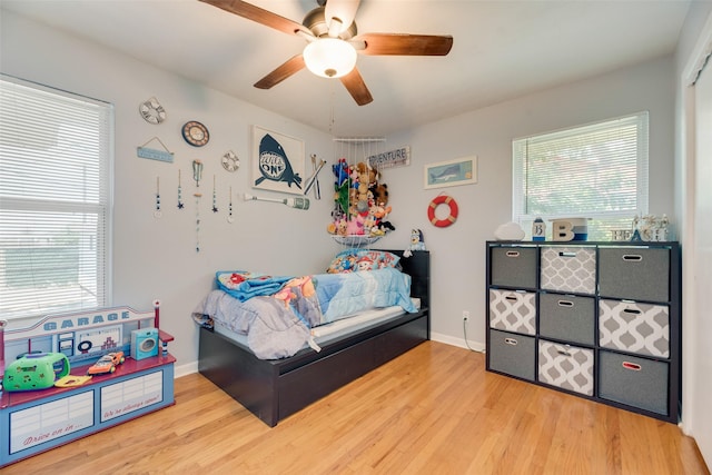 2315 Cardinal Ln, Garland, TX 75042 - bedroom with wood finished floors and ceiling fan