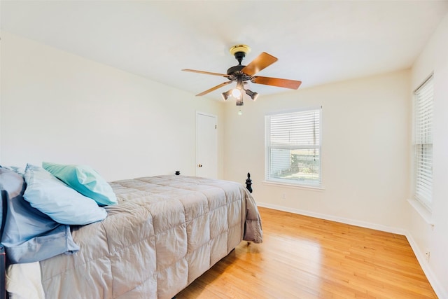 2315 Cardinal Ln, Garland, TX 75042 - bedroom with light wood-type flooring and ceiling fan