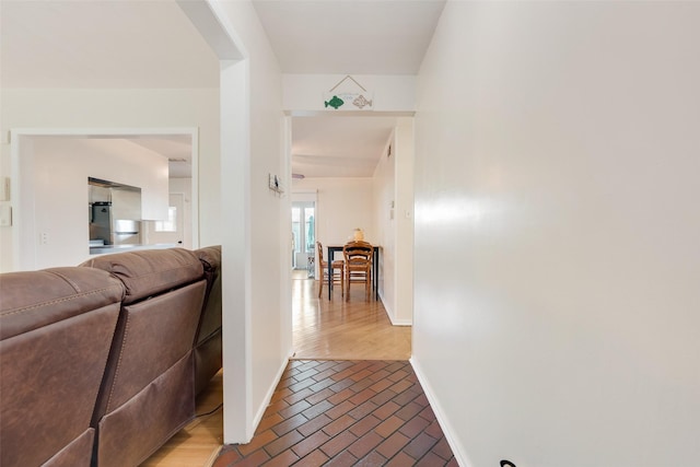 2315 Cardinal Ln, Garland, TX 75042 - hall with baseboards and brick floors