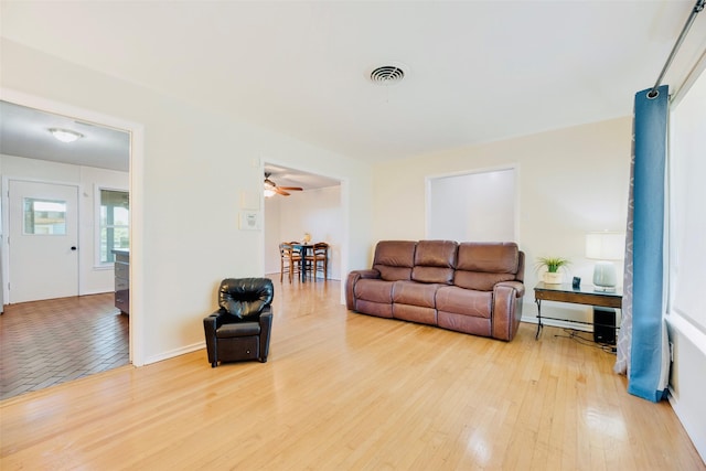 2315 Cardinal Ln, Garland, TX 75042 - living area with wood finished floors and a ceiling fan