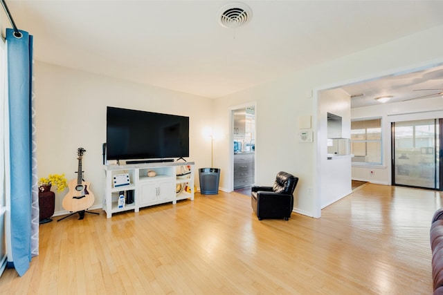 2315 Cardinal Ln, Garland, TX 75042 - living room featuring light wood-style floors and a ceiling fan