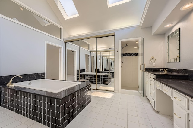 6226 Liberty Hl, Dallas, TX 75248 - full bath featuring a bath, vanity, tile patterned floors, a stall shower, and a skylight