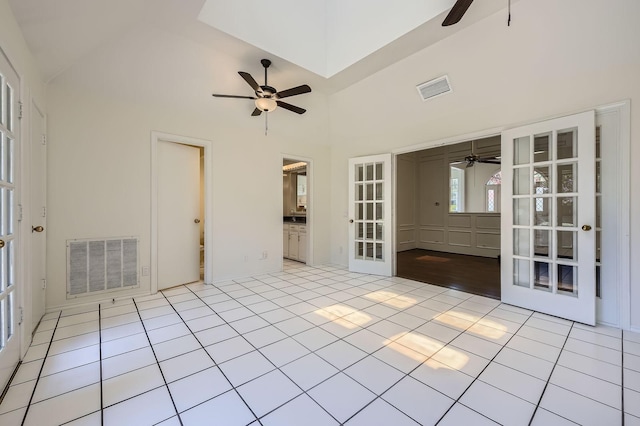 6226 Liberty Hl, Dallas, TX 75248 - empty room featuring ceiling fan, french doors, tile patterned flooring, and high vaulted ceiling