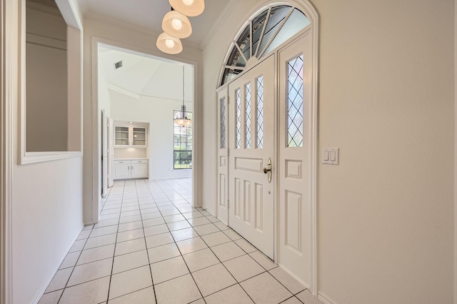 6226 Liberty Hl, Dallas, TX 75248 - entrance foyer featuring light tile patterned floors and crown molding