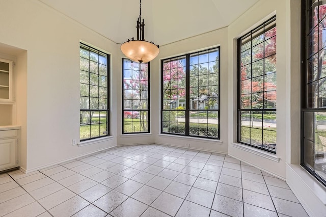 6226 Liberty Hl, Dallas, TX 75248 - unfurnished dining area featuring light tile patterned flooring and plenty of natural light