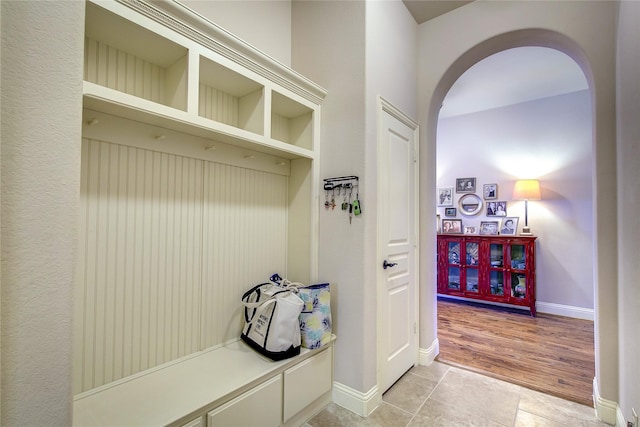 6341 Ashford Trl, Mesquite, TX 75181 - mudroom featuring arched walkways and light tile patterned flooring