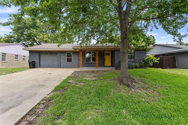 2628 Belhaven Dr, Mesquite, TX 75150 - view of front of home featuring a garage, driveway, brick siding, and covered porch