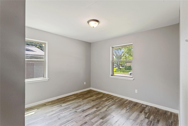 2628 Belhaven Dr, Mesquite, TX 75150 - spare room with healthy amount of natural light and wood finished floors