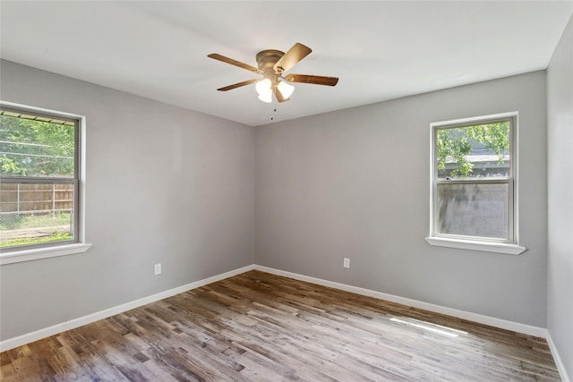 2628 Belhaven Dr, Mesquite, TX 75150 - unfurnished room featuring plenty of natural light, wood finished floors, and ceiling fan