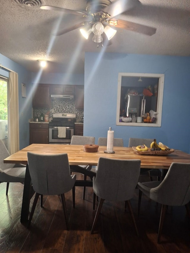 12634 Templeton Trl, Farmers Branch, TX 75234 - dining area with a textured ceiling, dark wood finished floors, and a ceiling fan