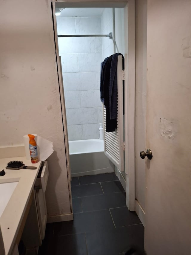 12634 Templeton Trl, Farmers Branch, TX 75234 - bathroom featuring tile patterned floors, vanity, and shower / tub combination