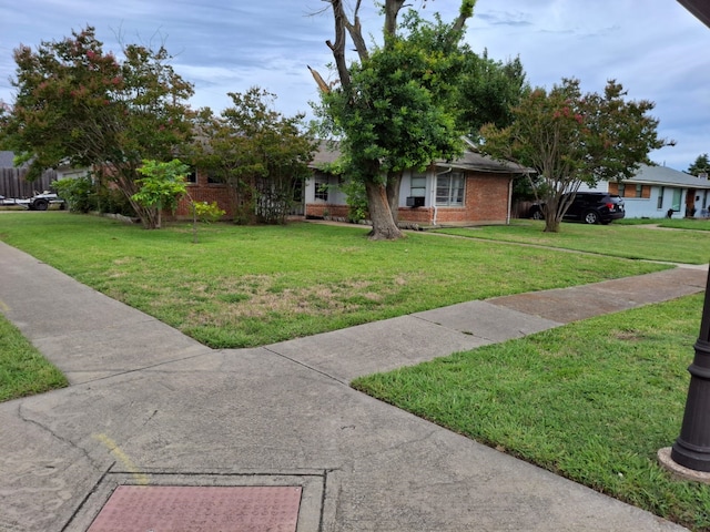12634 Templeton Trl, Farmers Branch, TX 75234 - view of front of house featuring a front yard and brick siding