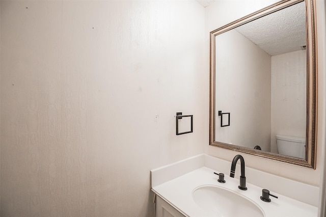 5907 Copperwood Ln Unit 1138, Dallas, TX 75248 - half bath with a textured ceiling and vanity
