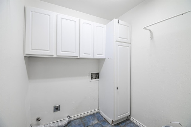 5907 Copperwood Ln Unit 1138, Dallas, TX 75248 - laundry room featuring electric dryer hookup, cabinet space, washer hookup, hookup for a gas dryer, and dark tile patterned floors
