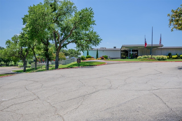 5907 Copperwood Ln Unit 1138, Dallas, TX 75248 - view of asphalt road featuring curbs