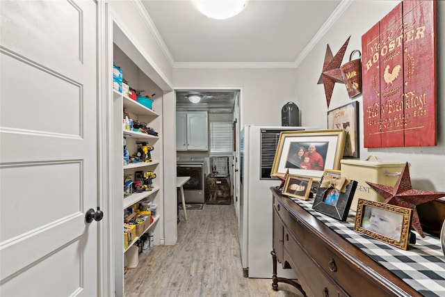 5270 Birch, Paris, TX 75462 - hallway featuring ornamental molding, washer / dryer, and light wood-type flooring