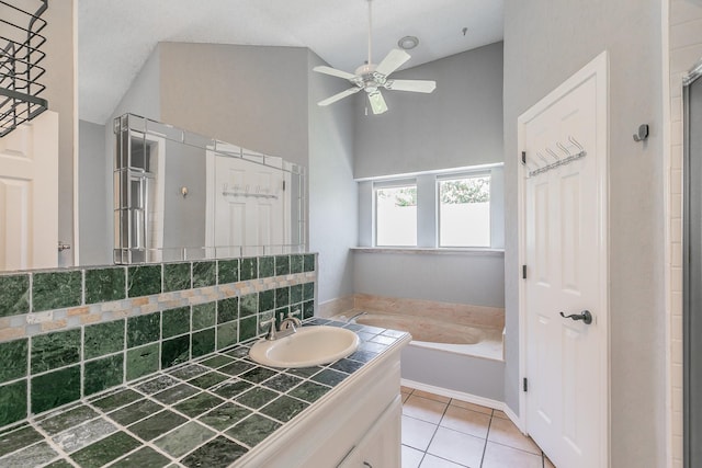 6215 Suffolk Dr, Arlington, TX 76001 - full bath featuring a garden tub, ceiling fan, vaulted ceiling, tile patterned floors, and vanity