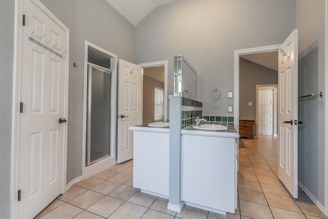 6215 Suffolk Dr, Arlington, TX 76001 - kitchen featuring vaulted ceiling and light tile patterned floors