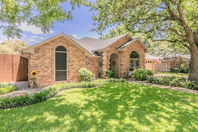 6215 Suffolk Dr, Arlington, TX 76001 - view of front of property featuring brick siding and an attached garage