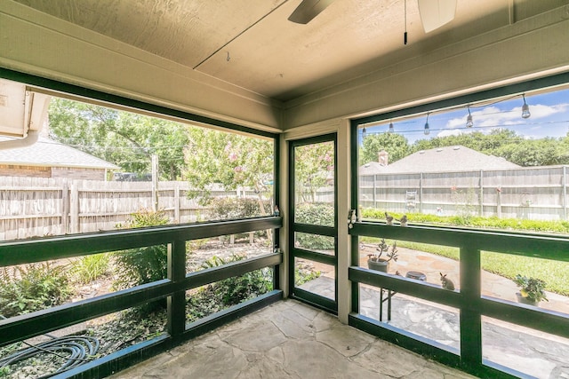 6215 Suffolk Dr, Arlington, TX 76001 - unfurnished sunroom featuring a ceiling fan