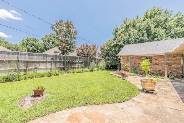 6215 Suffolk Dr, Arlington, TX 76001 - fenced backyard featuring a patio