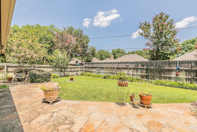 6215 Suffolk Dr, Arlington, TX 76001 - fenced backyard with a patio