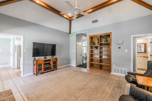 6215 Suffolk Dr, Arlington, TX 76001 - living area featuring tile patterned floors, ceiling fan, beam ceiling, and high vaulted ceiling