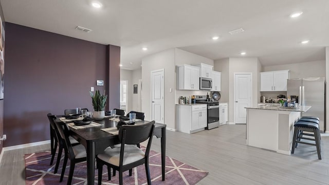 9453 Mint Hill Dr, Fort Worth, TX 76108 - dining room featuring light wood-type flooring and recessed lighting