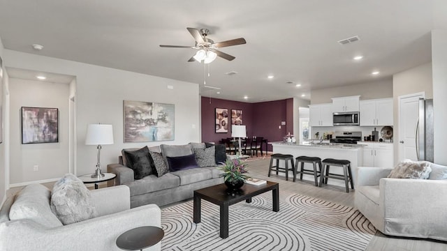 9453 Mint Hill Dr, Fort Worth, TX 76108 - living area with ceiling fan, light wood-style floors, recessed lighting, and attic access