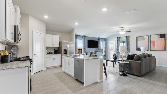 9453 Mint Hill Dr, Fort Worth, TX 76108 - kitchen with appliances with stainless steel finishes, open floor plan, ceiling fan, light wood-style flooring, and recessed lighting