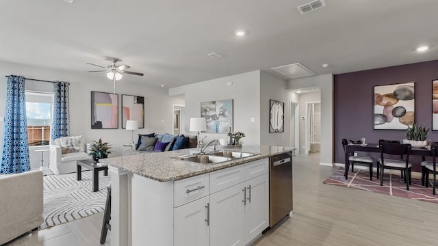 9453 Mint Hill Dr, Fort Worth, TX 76108 - kitchen featuring dishwasher, open floor plan, a ceiling fan, white cabinets, and a kitchen island with sink