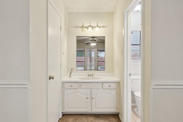 2017 Jessie Pl, Edgecliff Village, TX 76134 - bathroom with vanity, ceiling fan, and a textured ceiling