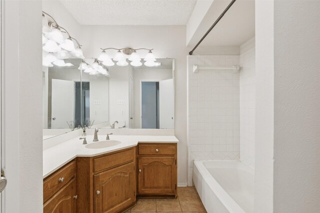 2017 Jessie Pl, Edgecliff Village, TX 76134 - full bathroom with vanity, tile patterned floors, and washtub / shower combination