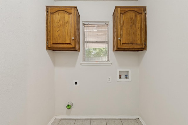 2017 Jessie Pl, Edgecliff Village, TX 76134 - washroom featuring hookup for an electric dryer, washer hookup, cabinet space, and tile patterned floors